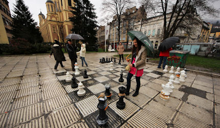 Locals brave the elements to play chess in the street